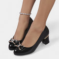 Ita - Zapatos de Tacón Bajo con Lazo Dorado.